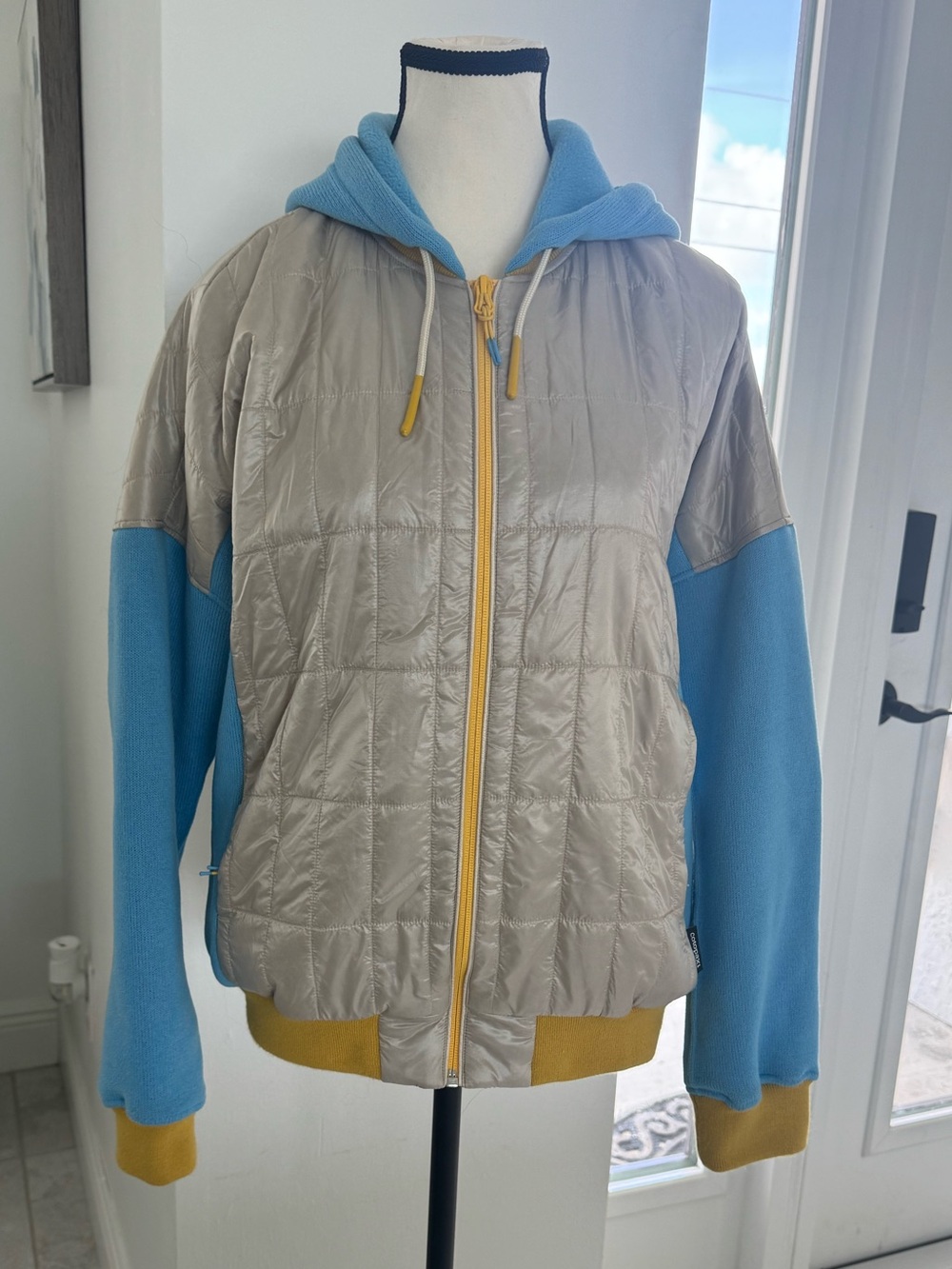 cotopaxi Silver and Blue Hooded Quilted Jacket with Yellow Trim